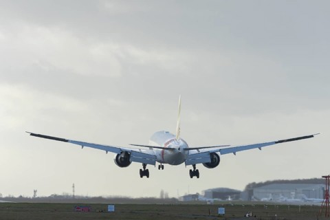 Boeing 777 commercial passenger airliner jet aircraft of Emirates airways landing on the runway at