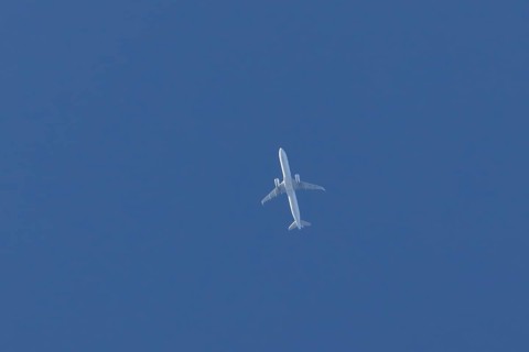 Airbus A321-200 commercial passenger airliner jet aircraft of Finnair airlines flying in a blue