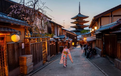 Japanese woman in kimono in an alley, Yasaka dori historic alleyway in the old town with