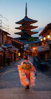 Japanese woman wearing kimono in an alley, Yasaka dori historic alleyway in the old town with