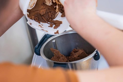 Preparation of chocolate ice cream in a mixer in the kitchen, vegan cake production, Haselstaller