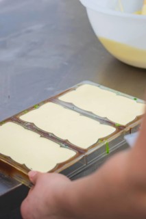 Chocolate molds on a table in a manufacturing environment, Vegan chocolate production, Haselstaller