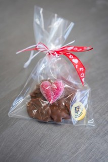 Chocolate snack with heart-shaped decoration in red gift packaging, Easter production of regional