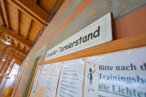 Information board with current tournament status on a brick wall, Schlehengäu Sporthalle Gechingen,