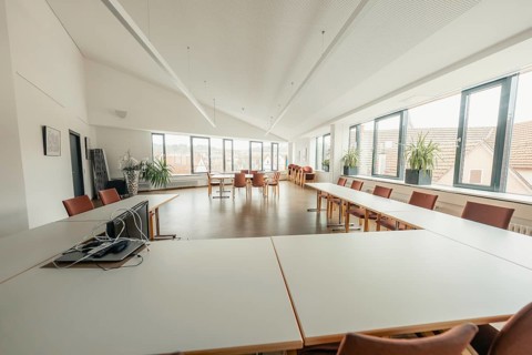 Bright meeting room with large windows and simple furniture, Gechingen Town Hall, Calw District,