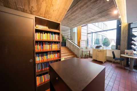 Modern interior design with bookshelves and large windows, Gechingen Town Hall, Calw district,