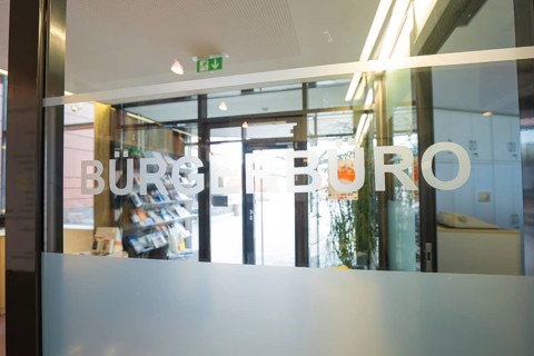 Glass panel with the inscription Bürgerbüro, modern entrance area with light incidence, Gechingen