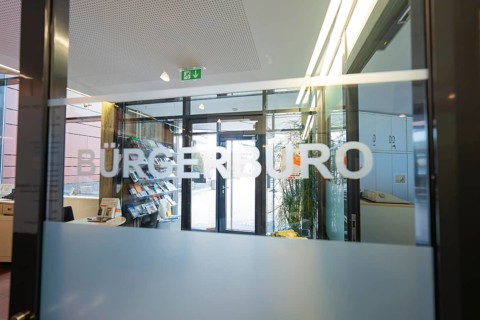Entrance to the Bürgerbüro with modern glass wall and fonts, bright interior design, Gechingen Town