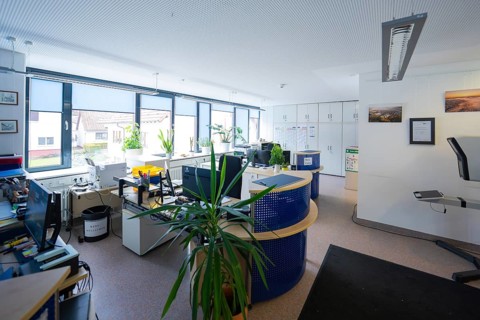 Modern office with desks, computers and plants in front of large windows, Gechingen Town Hall, Calw