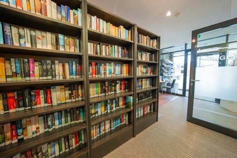 Modern library with bookshelves and glass walls, cozy atmosphere, Gechingen Town Hall, Calw