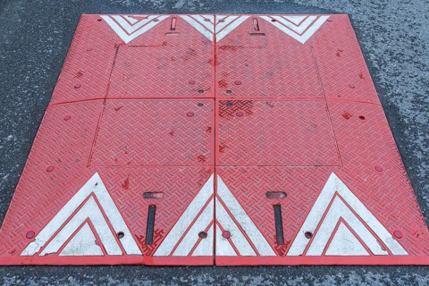 Red and white bump in a residential street in Lan´cut, formerly Landshut, Poland