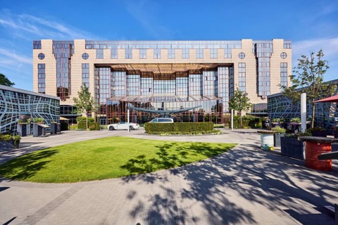 Hotel Hyatt Regency, commercial building, modern architecture, lawn, hedges, trees, blue sky,