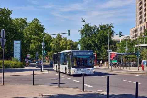 Public bus, general architecture, traffic light intersection, roads, trees, blue sky, cirrus