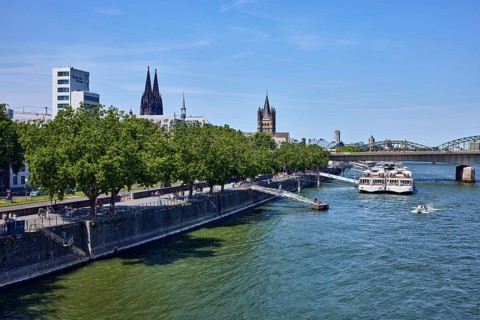 Rhine river, high-rise building, chamber of crafts, church towers of Cologne Cathedral and Groß St.