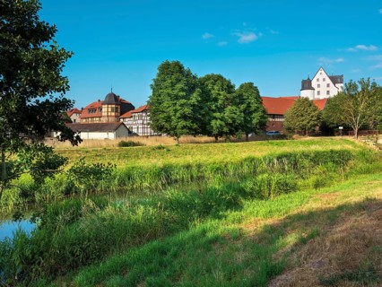 View across the Helme River to Heringen Castle, Thuringia, Germany