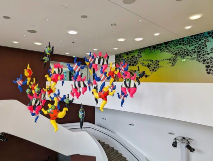 Colorful sculptures, Nanas, artist Niki de Saint Phalle, colorful figures, woman hanging in the