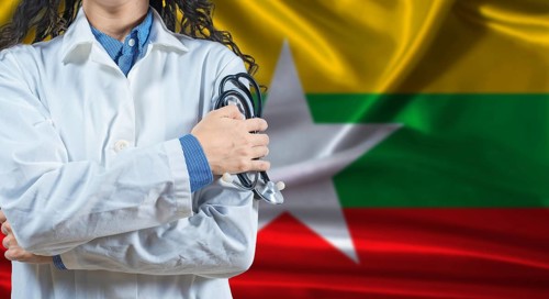 Healthcare professional with Myanmar flag background. Professional doctor holding stethoscope on
