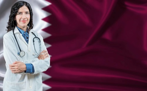 Qatari medicine and healthcare concept. Doctor close up against Qatar flag background