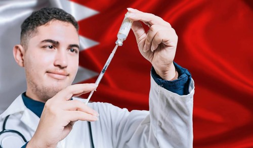 Doctor holding syringe on Bahrain flag background. Medical professional holding syringe with