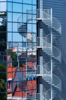 Modern glass façade with spiral staircase, fire escape, Erfurt, Thuringia, Germany