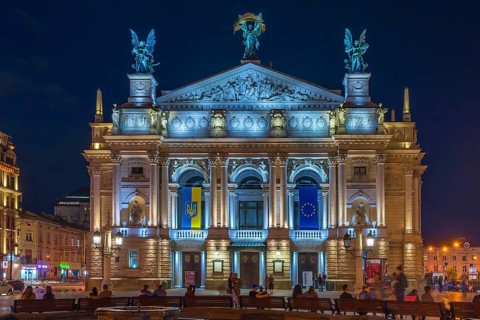 Opera house illuminated at night, Lviv, Ukraine