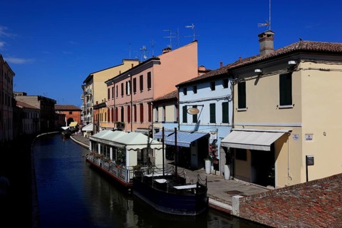 Old town with canal in the lagoon town of Comacchio in Emilia-Romagna, Ferrara province, Italy
