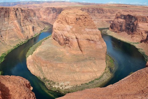 Impressive view of the Colorado River loop from Horseshoe Bend surrounded by red rocks, Arizona,