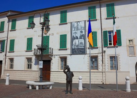 Italy, village of Brescello, the town hall, known from Don Camillo and Peppone, with a bronze