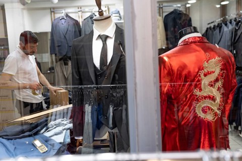 Istanbul, Turkey. June 23rd 2025. A Turkish tailors shop window with handmade suits on display near