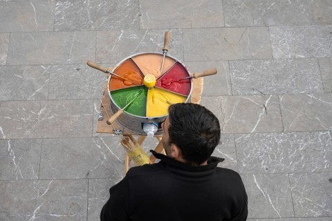 Istanbul, Turkey. December 2nd 2025. A Turkish street vendor selling brightly colored Macum, a
