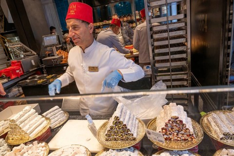 Istanbul, Turkey. December 2nd 2025. Turkish fez wearing staff inside Hafiz Mustafa baklava sweet