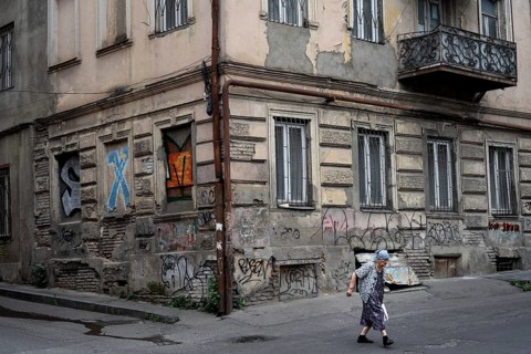Tbilisi, Georgia. July 15th 2025. An elderly Georgian lady crossing the street in the downtown