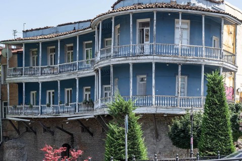 Tbilisi, Georgia. July 11th 2025. A Traditional Georgian style building with typical balcony in