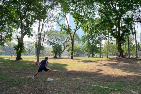 Bangkok, Thailand. March 4th 2025. A local man does some warm up stretches and exercises to keep