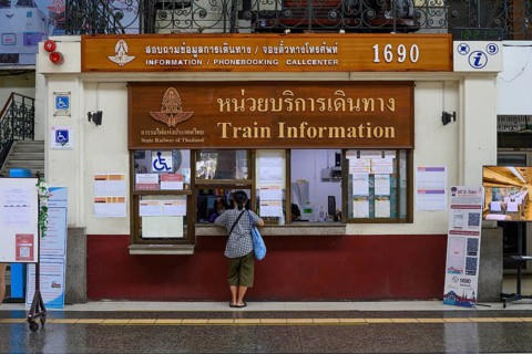 Bangkok, Thailand. February 16th 2025. A passenger at the Train Information kiosk at Hua Lamphong
