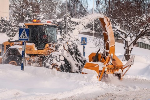 Snow blower clears snow on street in Ystad, Skåne County, Sweden, Scandinavia