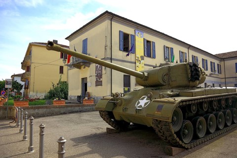 Italy, village of Brescello, film prop of restored M26 Pershing tanks in front of the museum of Don