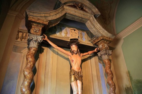 Italy, village of Brescello, cross from the movie, Don Camillo and Peppone in the church of