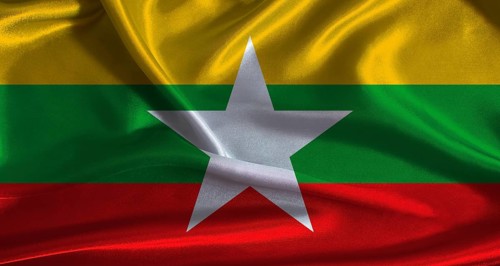 Myanmar flag with cloth textured background. National flag of Myanmar with realistic texture