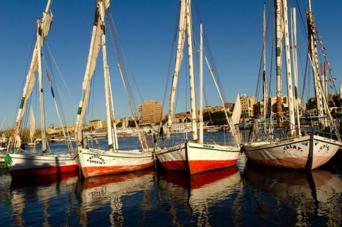 Aswan, Egypt. January 12th 2013 Beautiful painted Egyptian Felucca sail boats moored at Elephantine