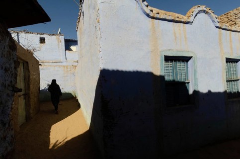 Aswan, Egypt. January 11th 2013 Bright blue traditional Nubian houses in the West bank Nile village