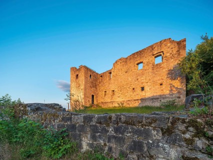 The ruins of Bramberg Castle in the Hassberg Mountains in the evening light, near Königsberg in