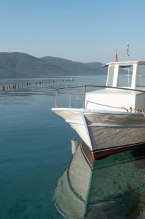 Stunning view of a boat moored in the beautiful harbour of Turkish Riviera seaside town of Akyaka