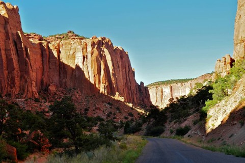 Tall rocks frame a road leading through a dramatic canyon landscape, Grand Staircase Escalante