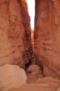 Narrow gorge in Bryce Canyon with high red rock walls on both sides, Bryce Canyon National Park,