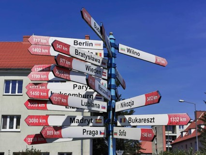 A signpost shows the distances to various European capitals, Gizycko, Masuria, Poland