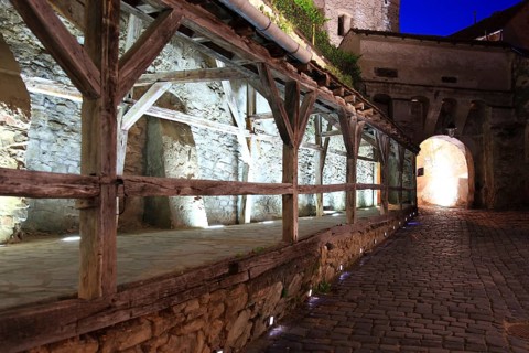 Romania, the way through the hour tower at blue hour in the historic old town of Sighisoara, German