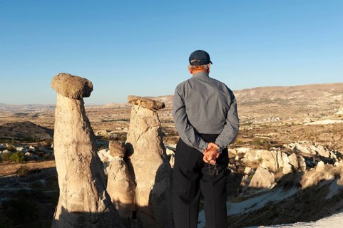 Urgup, Cappadocia, Turkey. September 18th 2018 A Turkish man enjoys the beautiful view of the Three
