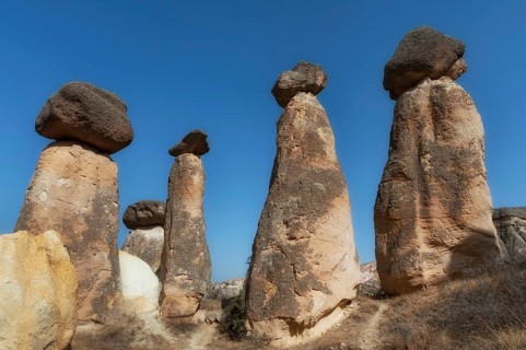 Soft morning light on the fairy chimney rock formations of the dramatic Anatolian landscape of