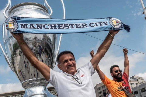 Istanbul, Turkey. June 9th 2023 A Manchester City football fan poses with a scarf in Taksim Square